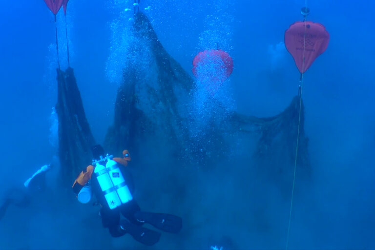 Divers from Ghost Diving Spain lift fishing net weighing 450 KG from reef in Tossa de Mar